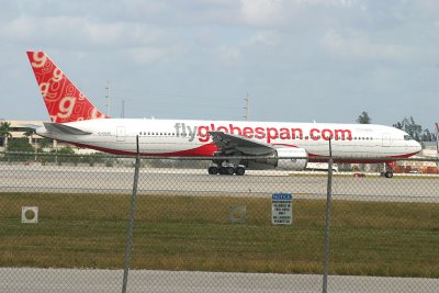 Flyglobespan's 767-300 being used for Santa Barbara Airlines' flight, note the sign on the fence