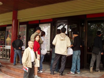 Buying tickets to the water puppet show