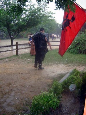 Slash appears to be up to something in the downpouring rain
