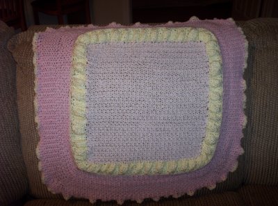 This blanket didn't turn out too well so I have since removed 1/2 of the darker pink (wide) border and will create a 2nd yellow bubble row to replace 1/2 of the wide dark pink.