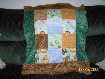 The day after Christmas I used the remaining remnants from Kittren's bluejean quilt and added to my minky remnants and made this blanket for Ryan. (I think blankets ended up being the most popular type of gift that Ryan received for Christmas.)