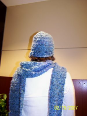 A requested matching (extra large) neck scarf and matching ski beanie hat.  The beanie has a chain stitch woven along the bottom row (closest to the neck/ears), that can be tightened and then tied in a bow to make the beanie less-likely to come of when skiing.  It's hard to see it but that bow is on the bottom left corner of the hat in this photo.