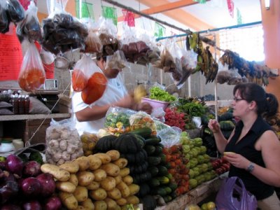 Stephanie purchasing fresh fruits