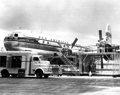 1949 - Mechanics working on Pan American Boeing 377-10-26 N1028V Clipper Flying Cloud at Miami International Airport