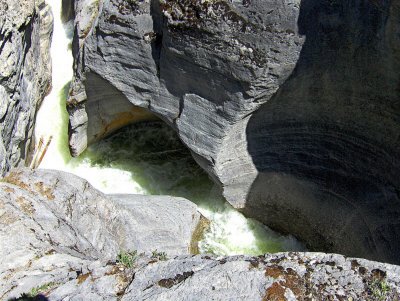 WATER STILL CARVES THROUGH THE ROCK