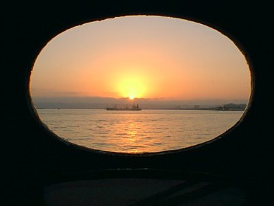 SUNSET THRU PORTHOLE.jpg