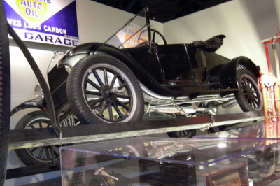 This 1926 Ford Model T is on its side in a 1923 Turn-Auto, used to get at the bottom of the car for repairs.