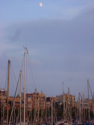 moonrise over the marina of barceloneta