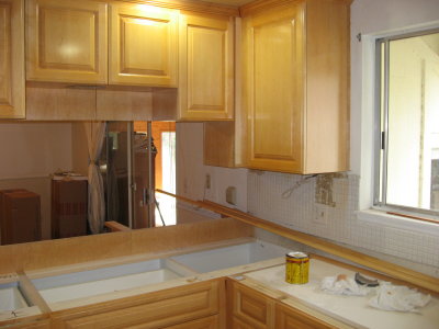 old backsplash, new cabinets and lights, boxes with new sink.JPG