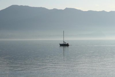 Lonely sailing boat in no wind