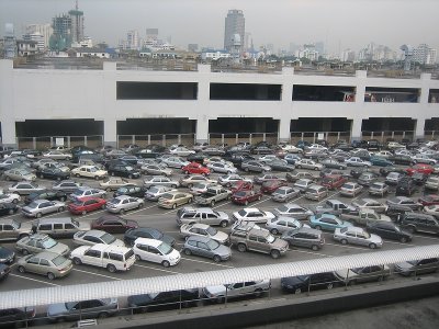 In Thailand it is very common to double park your car and leave it without the parking break. People will just push it away further when their car is blocked and they want to leave