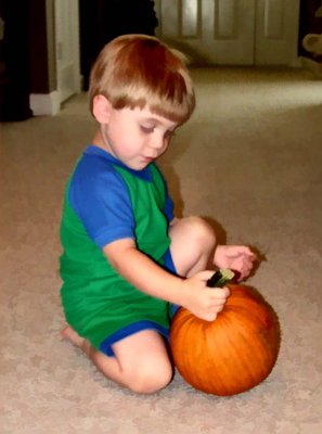 Ian and his pumpkin.JPG