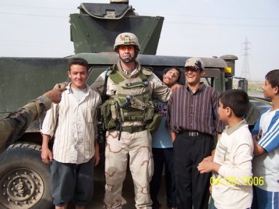 Captain Borders (506th / 822nd SFS Operations Officer) and Iraqi children