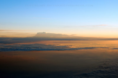 Sunset over the clouds