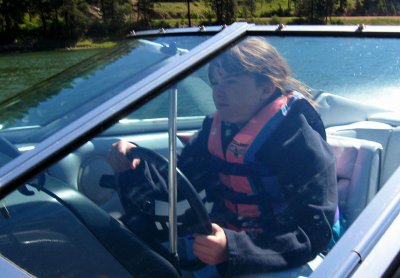 Sydney driving the boat