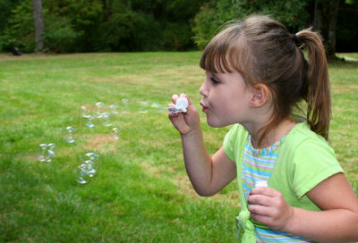 Hannah blowing bubbles