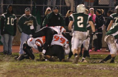 aylward, jones, and chapman make the tackle