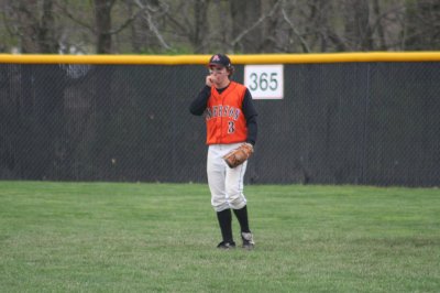 ethan keeps his hands warm in right field