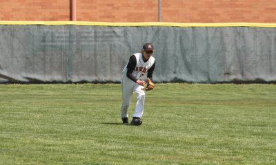 adam plays a ball in left field