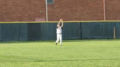 adam makes a catch in left field