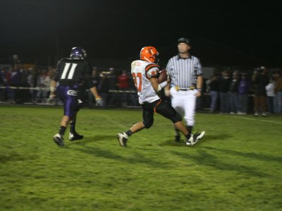 elijah carries the ball into the end zone