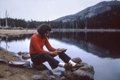 Richard on a backpacking trip in the mountains of Montana - panning for gold - no luck (8/1972)