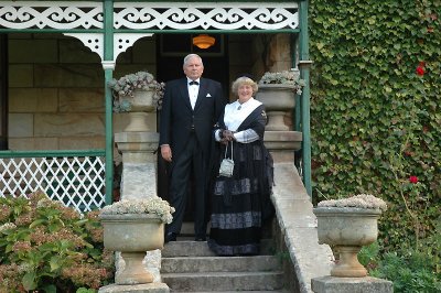 Essex and Janet Barrett on the steps of their home