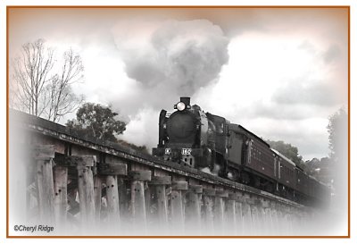 1254- k160 steam train and trestle bridge near castlemaine