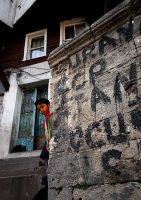 kid near the wall in balat-colors in istanbul
