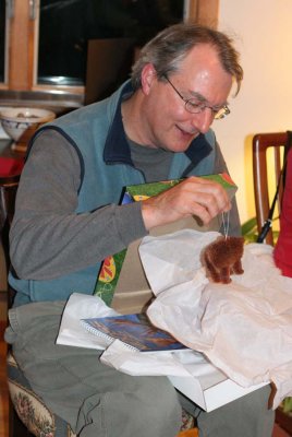 Peter opens his bear ornament