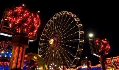 Ferris wheel seen through another ride