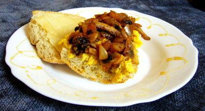 french bread, scrambled eggs, cacao/chili/cumin mushrooms & onions, aged manchego and honey