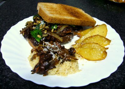 sayten burger with sauteed pears and couscous, topped with mexican mushrooms and aged manchego