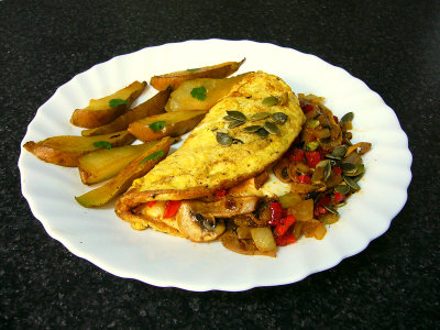 omelette w/cumin sauteed peppers, onions and mushrooms, plus burgos cheese & cumin gouda served w/golden browned pears &cilantro