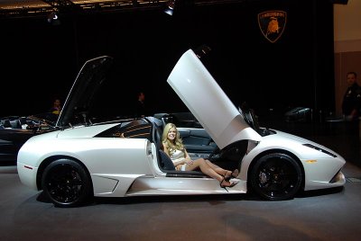 Lovely lady showing off a Lamborghini Murcilago