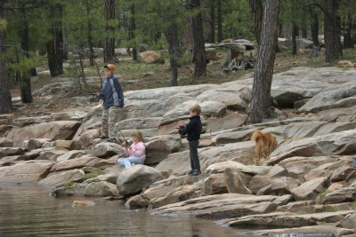 Kids and dog fishing