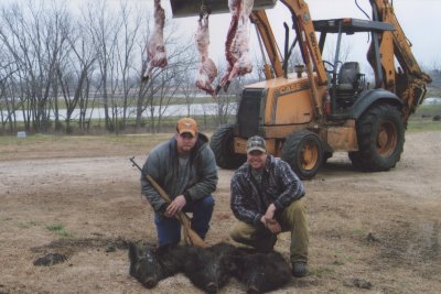 Using the backhoe to hang the meat