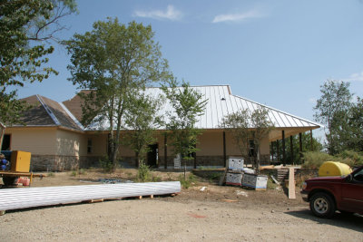 Roof panels going up on the back of the house