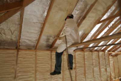 Spraying on the closed cell foam insulation over the radiant barrier