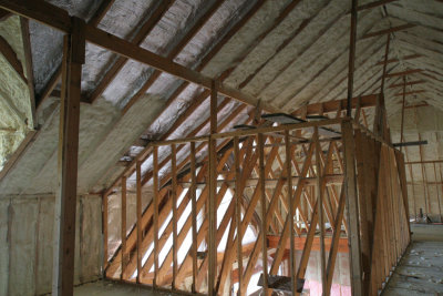 Insulation is partway done on the ceiling
