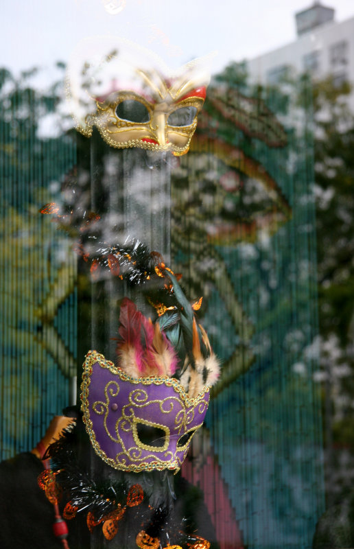 International Apparel Store - Masks in Window with Reflections