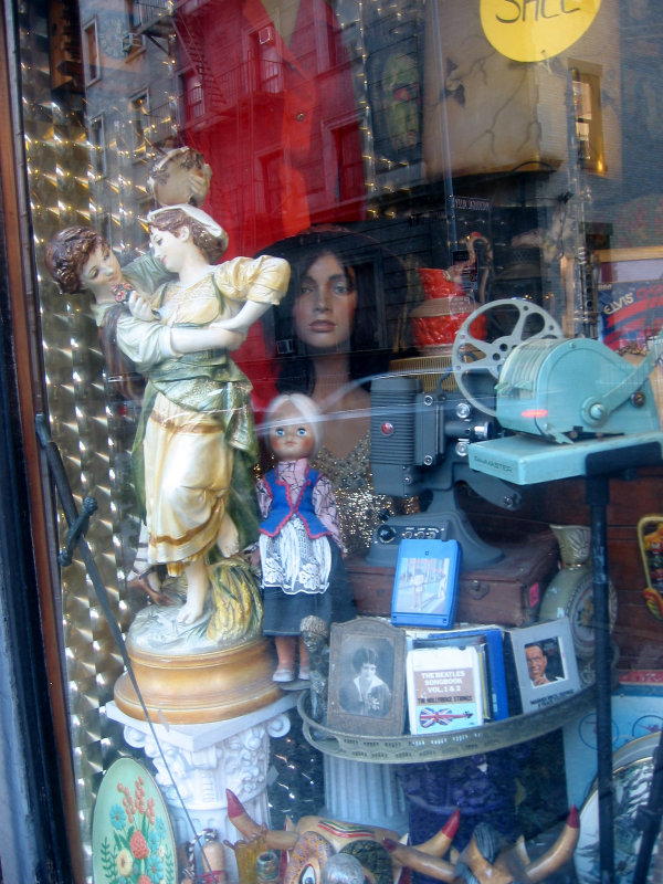 Thrift Shop Window with Reflection of MacDougal Mews