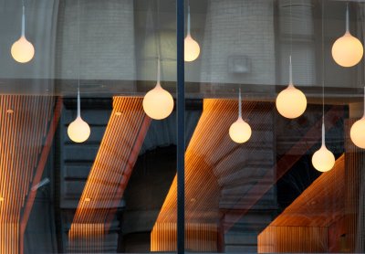 NYU Business School Lights and Window Reflecting Paulette Goddard Residence Hall