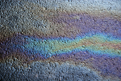 Water, Oil and Sunlight on an  Asphalt Road