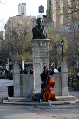 Bass Player at the Holly Statue