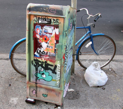 Bicycle by a News Box