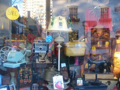 Thrift Shop Window with Reflection of MacDougal Mews