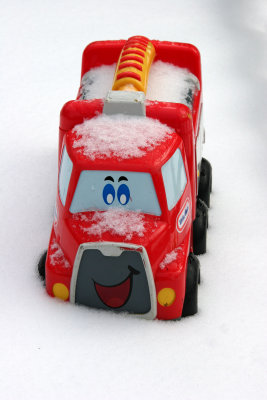 Sandpile Toy Vehicle Buried in the Snow
