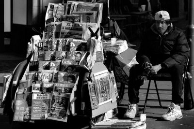 the melancholy of a newspaper vendor