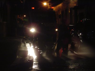 Los Bomberos (Firefighters) cleaning the streets the night before
